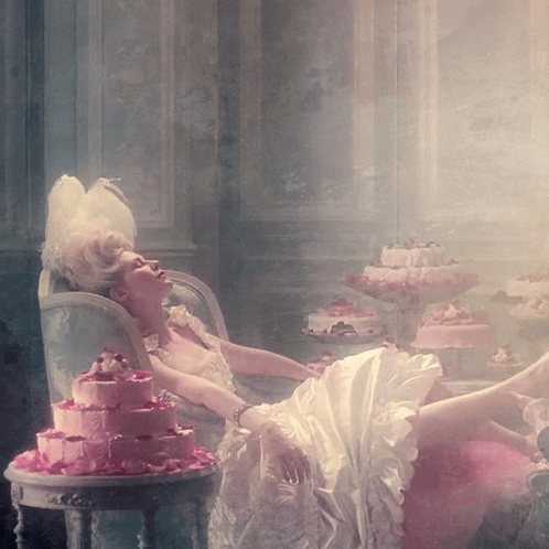 https://tenor.com/view/marie-antoinette-cake-queen-of-france-gif-16752079.gif