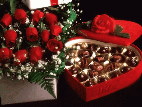 https://tenor.com/view/red-roses-chocolates-gif-7275243.gif